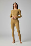 Mustard yellow long-sleeve top and pants on a light gray background