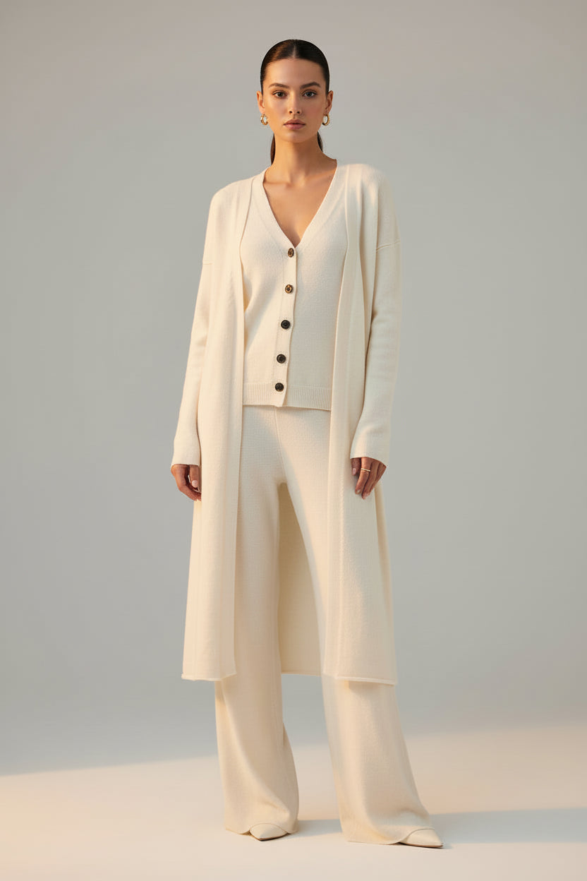 White cardigan and pants set on a white background