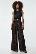 Leopard print wide-leg pants worn by a person on a white background