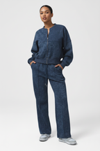 Person wearing a blue tracksuit on a white background