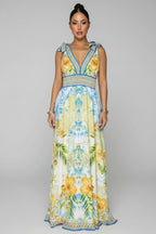Woman wearing a colorful floral dress in an indoor setting