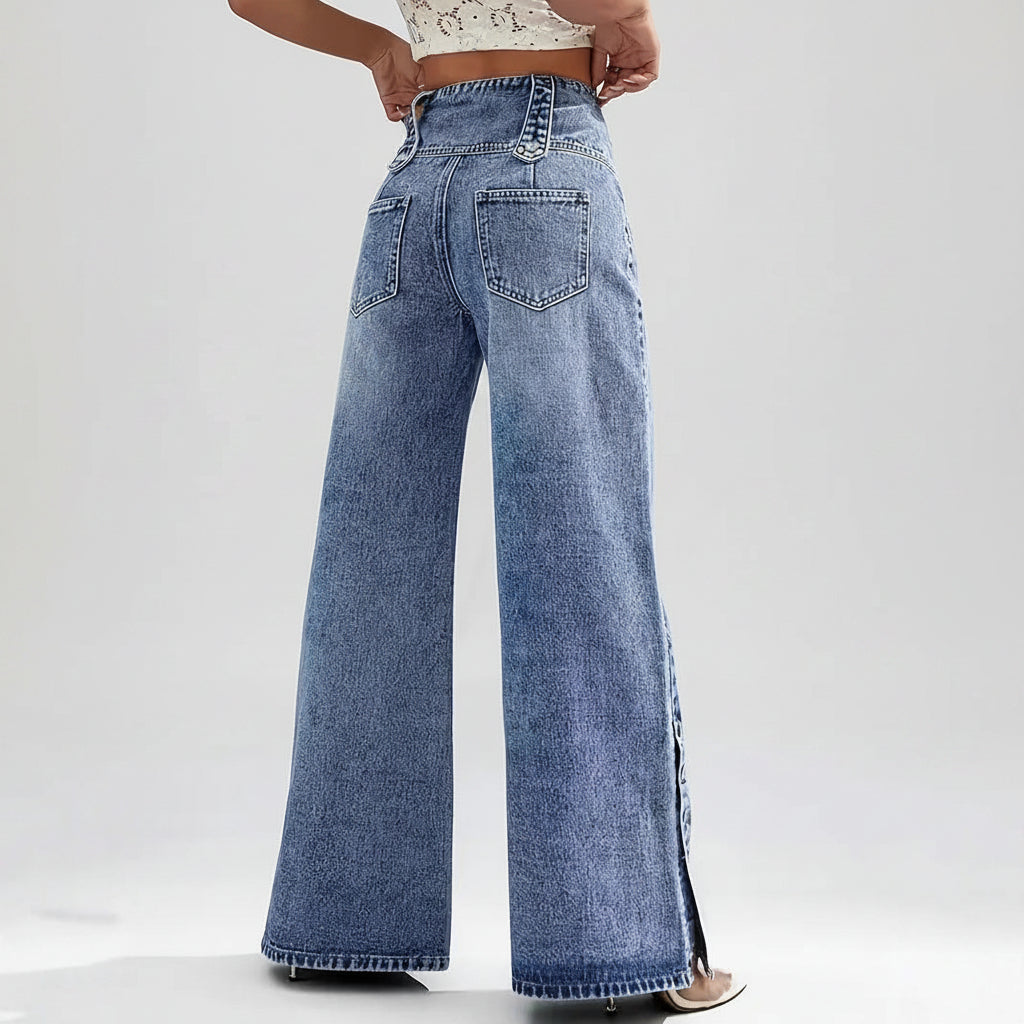 Person wearing blue wide-leg jeans on a city street background