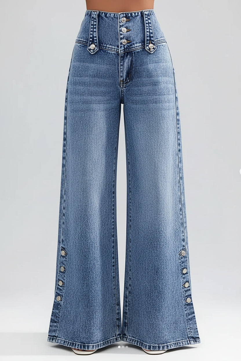 Wide-leg jeans with decorative buttons on a blurred city street background