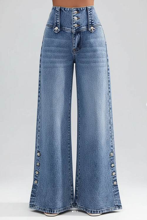 Wide-leg jeans with decorative buttons on a blurred city street background