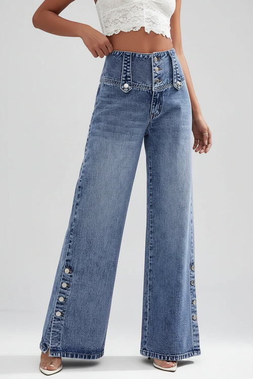Person wearing wide-leg jeans on a city street.