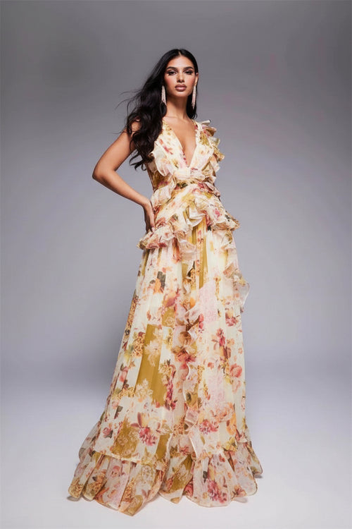Woman wearing a floral dress against a gray background