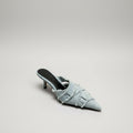 Light blue denim pointed-toe mule shoe on a white background