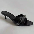 A black PU leather sandal with a round head and a decorative buckle, featuring a wine glass heel.