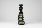 Black strappy high-heeled sandal with zebra pattern on a white background