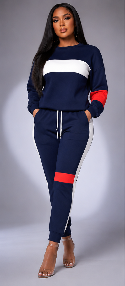 A three-panel studio photo of a woman modeling a matching color-block sweatshirt and jogger set. The left panel shows a navy, white, and red version; the center panel shows a black, white, and red version; the right panel shows the back view of the black set.
