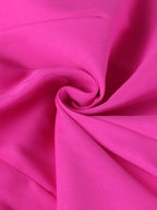 Close-up of pink fabric with folds