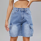 A pair of blue denim cargo shorts with pockets and a zipper, designed for women.