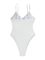 White swimsuit with thin straps on a white background
