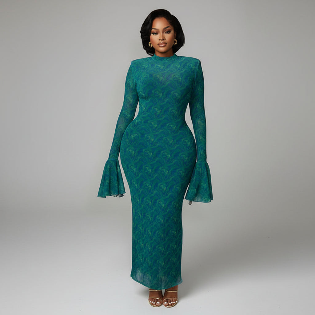 Woman in a teal dress standing in an elegant interior setting