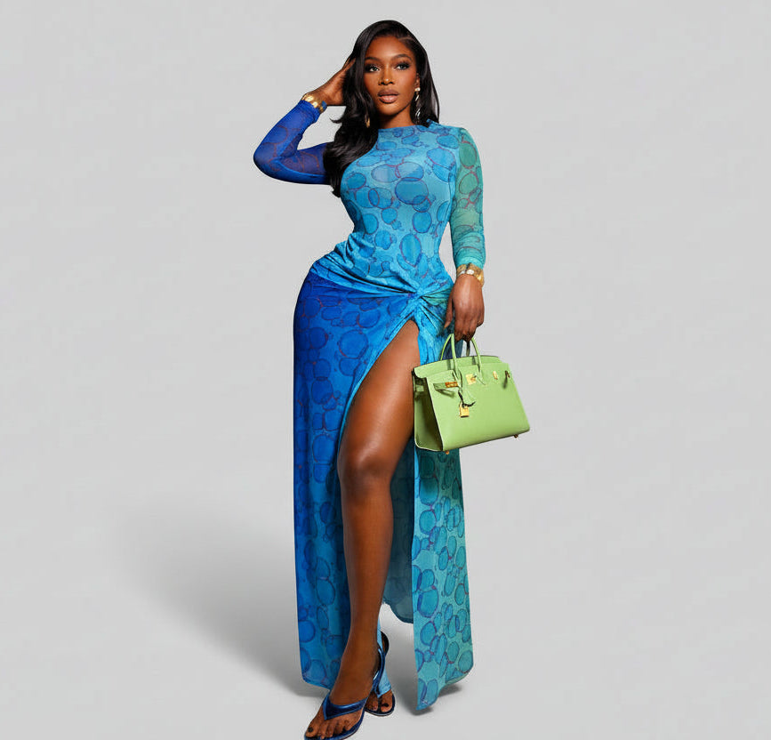 Woman in a blue dress holding a green handbag on a staircase