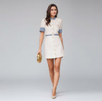 Woman in a short dress walking on a city street