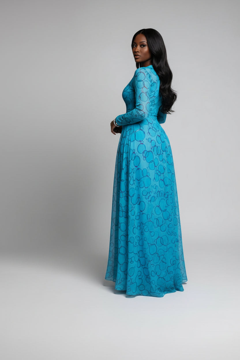 Woman in a blue dress holding a green handbag in a dark setting