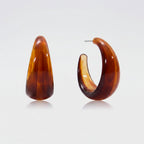 Brown earrings with measurements and product details on a white background