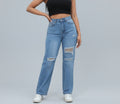 Person wearing high-waisted blue jeans with rips on a gray background